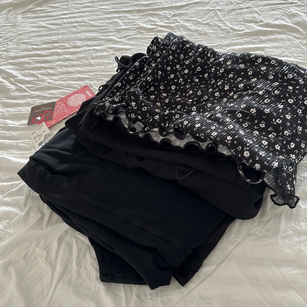 One jumpsuit, two maxi dresses, and three mini dresses in black